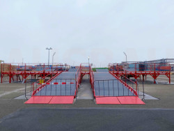 Krovimo rampos, kuriomis vienu metu galima pakrauti keturis sunkvežimius